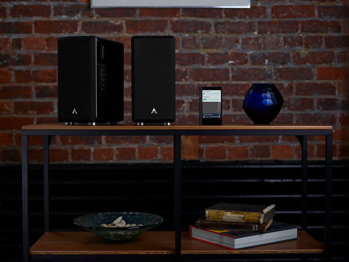 These elegant compact bookshelf speakers are sold as a pair creating a great sounding home stereo system to connect with legacy audio gear or operate with minimal components in a modern digital environment.  Up to four additional FS-252 systems can be easily added to create more sound output or create multi-room capability with a range of up to 150 feet.  Each FS-252 system comes with a seven button IR remote which duplicates the side mounted system control panel.