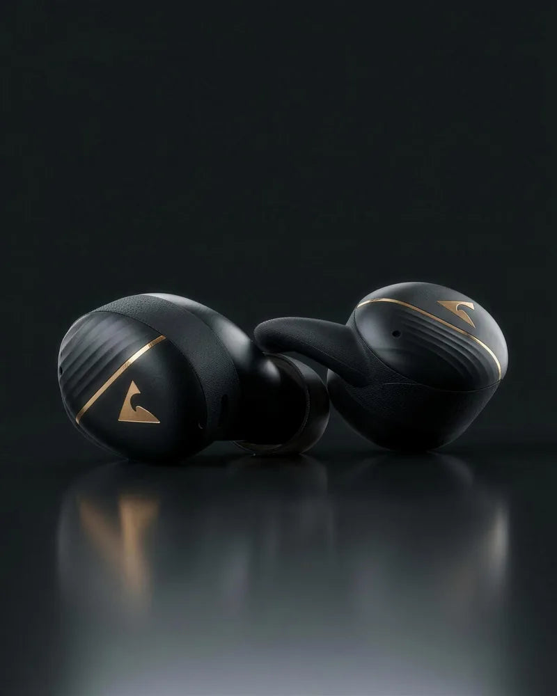 Black earbuds on a dark surface